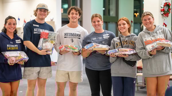 Neumann-lacrosse-volunteers-at-stockings-for-soldiers